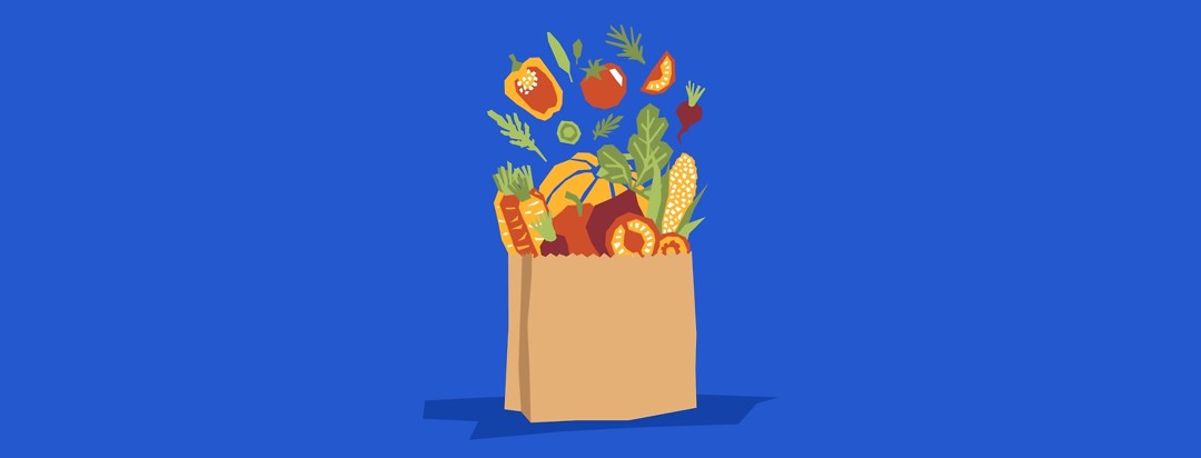 Grocery bag with healthy fruits and vegetables coming out