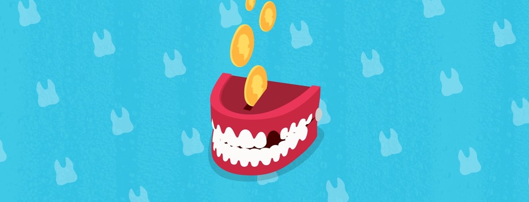 Set of red toy teeth with one tooth missing with coins going into it