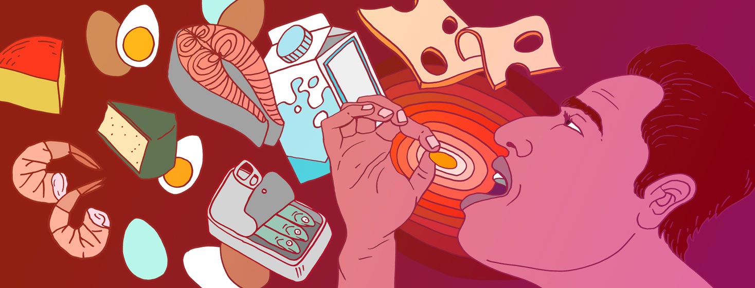 a man holds a b12 pill as foods rich in B12 swirl around him