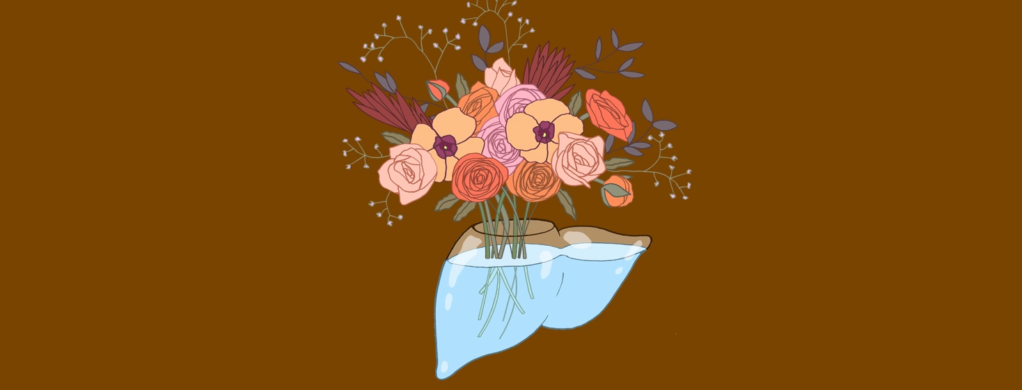 a glass liver is actually a vase filled with water and a beautiful bouquet of flowers