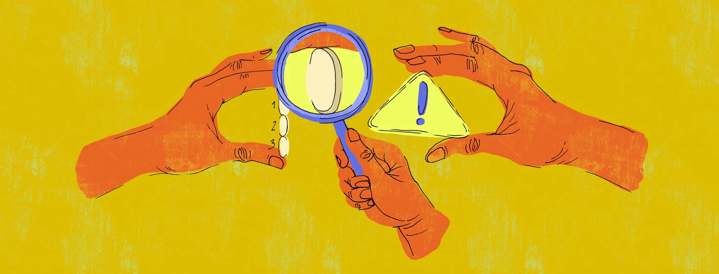 a hand with a magnifying glass is inspecting another hand holding mavyret pills