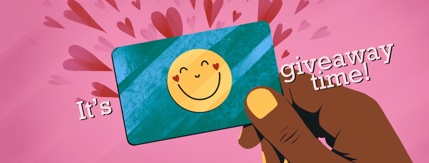 A hand holding a gift card